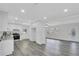 Bright kitchen with white cabinets, granite countertops, and stainless steel appliances at 5774 Forest Dr, Acworth, GA 30102