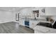Modern kitchen with white cabinets, granite countertops, and stainless steel appliances at 5774 Forest Dr, Acworth, GA 30102