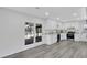 Modern kitchen with white cabinets, granite countertops, stainless appliances, and stylish flooring at 5774 Forest Dr, Acworth, GA 30102