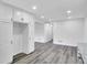 Modern kitchen with white cabinets and granite countertops, with gray flooring at 5774 Forest Dr, Acworth, GA 30102