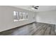 Inviting living room features large windows and modern gray flooring at 5774 Forest Dr, Acworth, GA 30102