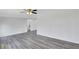 Spacious living room features hardwood floors, white walls and ceiling fan at 5774 Forest Dr, Acworth, GA 30102