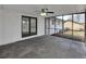 Enclosed screened porch with stone flooring, white brick wall, and backyard views at 5774 Forest Dr, Acworth, GA 30102