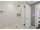 Shower with white subway tile surround, glass door, and modern fixtures at 1101 Juniper Ne St # 1012, Atlanta, GA 30309