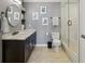 Modern bathroom with a dark wood vanity, marble countertop, and glass-enclosed shower at 1101 Juniper Ne St # 1012, Atlanta, GA 30309