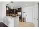 Open kitchen with stainless steel appliances, stylish pendant lighting, and tiled flooring at 1101 Juniper Ne St # 1012, Atlanta, GA 30309
