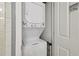 Convenient laundry closet featuring a stacked washer and dryer unit at 1101 Juniper Ne St # 1012, Atlanta, GA 30309