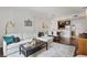 Open-concept living room with modern decor and a view into the dining and kitchen areas at 1101 Juniper Ne St # 1012, Atlanta, GA 30309