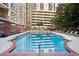 Sparkling outdoor pool with comfortable lounge chairs, perfect for relaxation and summer fun at 1101 Juniper Ne St # 1012, Atlanta, GA 30309