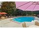 Community pool with sun loungers and shade umbrellas at 1101 Juniper Ne St # 1012, Atlanta, GA 30309