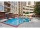 Condo complex pool with sun loungers and city views at 1101 Juniper Ne St # 1012, Atlanta, GA 30309
