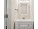 Clean, minimalist bathroom design with modern vanity and fixtures, creates a serene space at 153 Towey Trl, Woodstock, GA 30188
