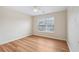 Bright bedroom featuring gorgeous hard wood floors and a ceiling fan at 153 Towey Trl, Woodstock, GA 30188
