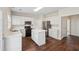 Spacious kitchen with island, stainless appliances, and ample storage, ideal for culinary enthusiasts at 153 Towey Trl, Woodstock, GA 30188