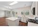 Stylish kitchen with stainless steel appliances, white cabinets, and a center island for meal preparation at 153 Towey Trl, Woodstock, GA 30188