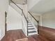 Spacious living area with hardwood floors and elegant staircase at 153 Towey Trl, Woodstock, GA 30188