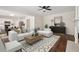 Cozy living room features hardwood floors, fireplace, and ample seating at 153 Towey Trl, Woodstock, GA 30188