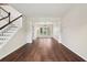 Open-concept living area with hardwood floors and staircase at 153 Towey Trl, Woodstock, GA 30188