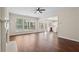 Bright living area with large windows, fireplace, and adjacent kitchen view for easy living at 153 Towey Trl, Woodstock, GA 30188