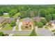 An aerial view of a sprawling property showcasing its well-manicured lawns and mature trees at 240 Flowers Cove Ln, Lilburn, GA 30047