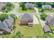 Aerial view of a home showcasing its expansive backyard and neighboring houses in a residential area at 240 Flowers Cove Ln, Lilburn, GA 30047