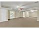 Finished basement space with plush carpeting, recessed lighting and multiple rooms at 240 Flowers Cove Ln, Lilburn, GA 30047