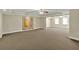 Large open basement area with wall art, plush carpet and recessed lights at 240 Flowers Cove Ln, Lilburn, GA 30047