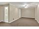 Finished basement area with recessed lighting, carpeted floors and adjacent bathroom at 240 Flowers Cove Ln, Lilburn, GA 30047
