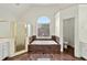 Bathroom featuring a soaking tub, separate shower, tile accents, and natural lighting at 240 Flowers Cove Ln, Lilburn, GA 30047