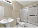 Bathroom with single sink, standing shower, and toilet at 240 Flowers Cove Ln, Lilburn, GA 30047
