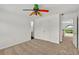 Carpeted bedroom with a colorful ceiling fan and ample closet space at 240 Flowers Cove Ln, Lilburn, GA 30047