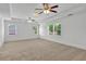 Spacious bedroom with windows providing natural light at 240 Flowers Cove Ln, Lilburn, GA 30047