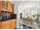 The staged dining room features a butler's pantry and chandelier at 240 Flowers Cove Ln, Lilburn, GA 30047