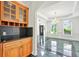 Elegant dining area with custom cabinetry, marble floors, and an inviting open design, perfect for entertaining guests at 240 Flowers Cove Ln, Lilburn, GA 30047
