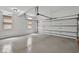 The garage features a clean, open space with a garage door and a window at 240 Flowers Cove Ln, Lilburn, GA 30047