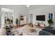 Staged living room boasts ample seating and decor at 240 Flowers Cove Ln, Lilburn, GA 30047
