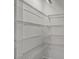 Walk-in pantry with ample white shelving for organized storage at 240 Flowers Cove Ln, Lilburn, GA 30047