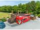 Unique double-decker bus restaurant with outdoor seating, creating a fun and inviting dining experience at 240 Flowers Cove Ln, Lilburn, GA 30047