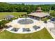 Community splash pad with shaded seating, providing a fun and refreshing recreational amenity for residents at 240 Flowers Cove Ln, Lilburn, GA 30047