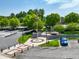 Scenic town square featuring an American flag, manicured landscaping, and pedestrian-friendly layout at 240 Flowers Cove Ln, Lilburn, GA 30047