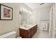 Bathroom with double sinks, large mirror, and ample cabinet space at 2819 Saddlebrook Nw Way, Marietta, GA 30064