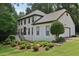 Elegant two-story home with manicured lawn and lush landscaping, steps lead to arched entry at 2819 Saddlebrook Nw Way, Marietta, GA 30064