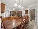 Open kitchen and dining area with wooden cabinets, stainless steel appliances, and island seating at 2819 Saddlebrook Nw Way, Marietta, GA 30064