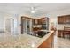 Spacious kitchen featuring a large island with cooktop, stainless steel appliances, and wooden cabinetry at 2819 Saddlebrook Nw Way, Marietta, GA 30064