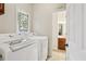 Laundry room with side-by-side washer and dryer and an adjacent bathroom at 2819 Saddlebrook Nw Way, Marietta, GA 30064