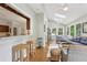 Bright sunroom with hardwood floors, skylights, and comfortable seating area overlooking the yard at 2819 Saddlebrook Nw Way, Marietta, GA 30064