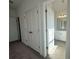 This is a bright bathroom that has a toilet and vanity with a countertop and mirror at 518 Healy Dr # 68, Cumming, GA 30040
