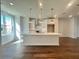 Bright kitchen with modern pendant lighting and stainless steel appliances at 518 Healy Dr # 68, Cumming, GA 30040