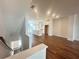 Spacious living room with hardwood floors that opens to the kitchen at 518 Healy Dr # 68, Cumming, GA 30040