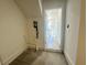 Mudroom with white walls and view of front door at 518 Healy Dr # 68, Cumming, GA 30040